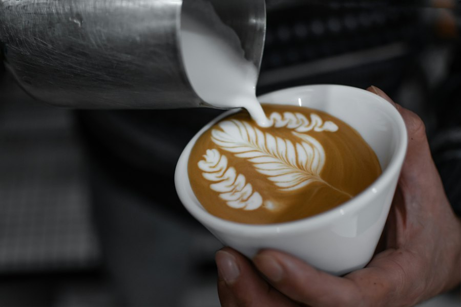 A cappuccino with latte art on a wooden table