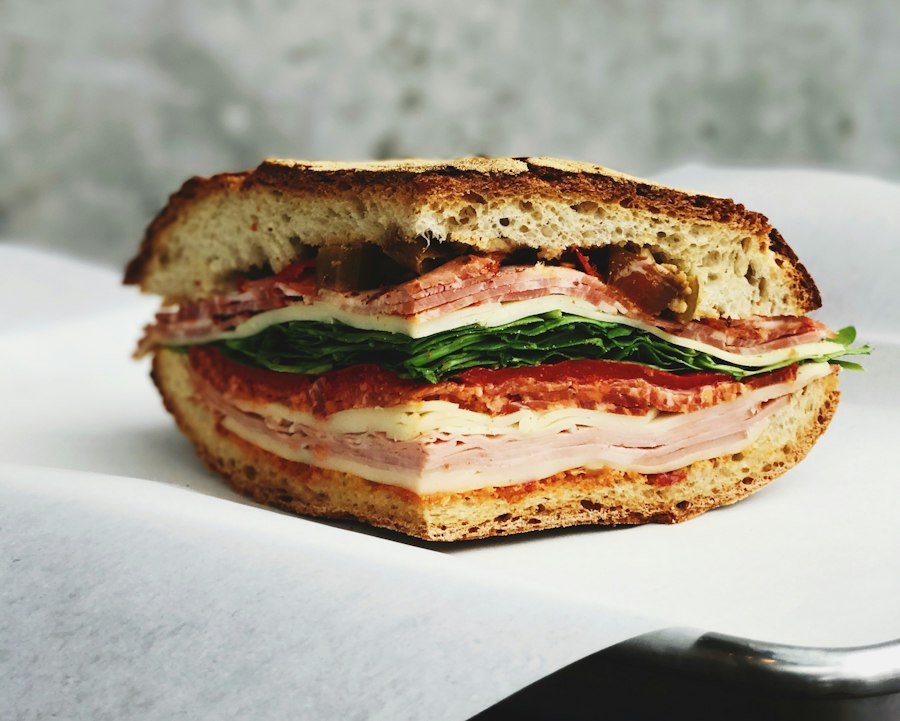 A sandwich on sourdough, sliced in half