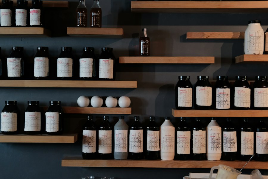 Rows of unlabelled apothecary-style bottles on dark wooden shelves